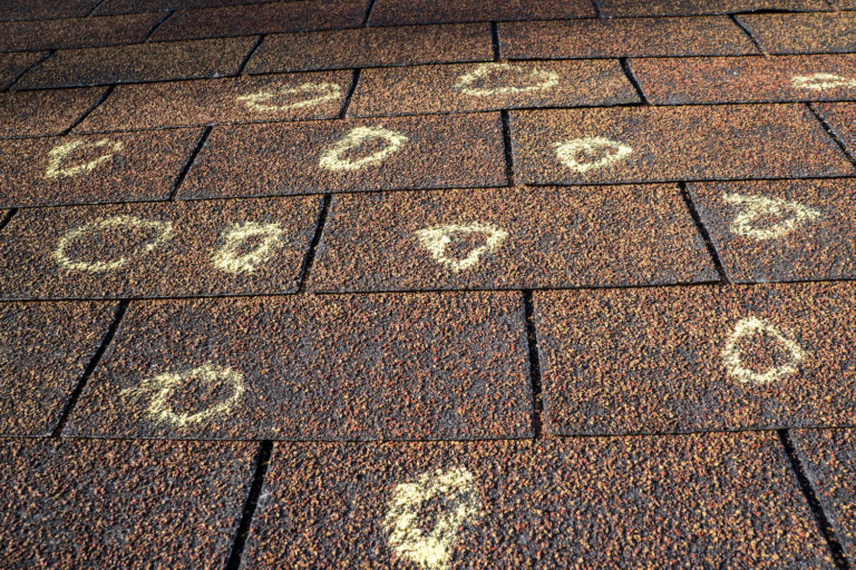 insurance claim for roof hail damage markings on shingles