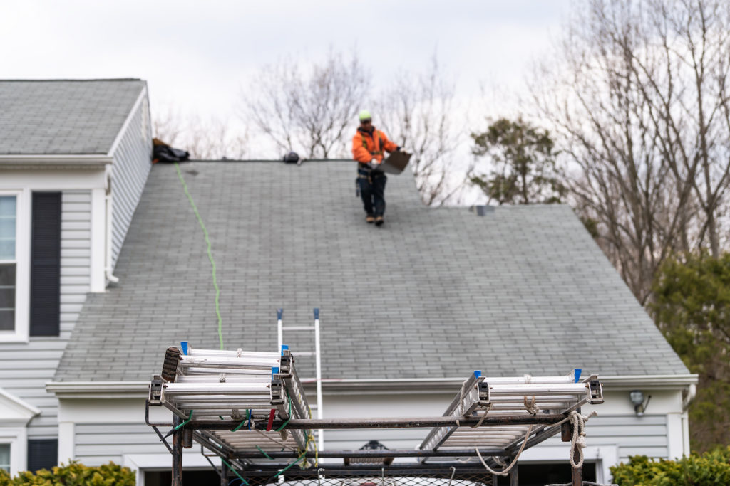 madison roofing contractor ladders in focus