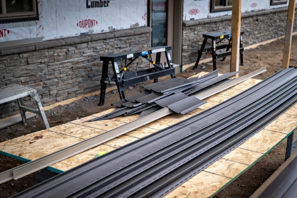 vinyl sidings being prepared to cut before installation on construction site