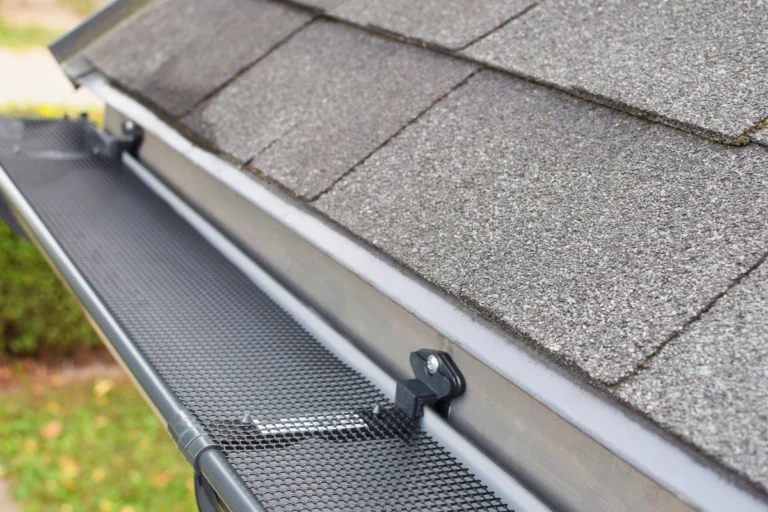 close up installation of gutter guards