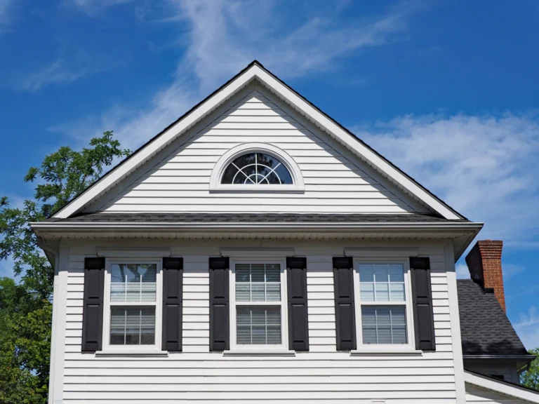 new siding installed house with large windows