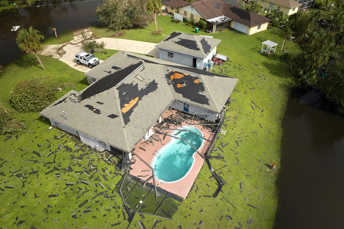http://tornado%20damage%20to%20residential%20roof%20and%20pool