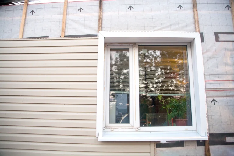 family house getting vinyl siding replacement