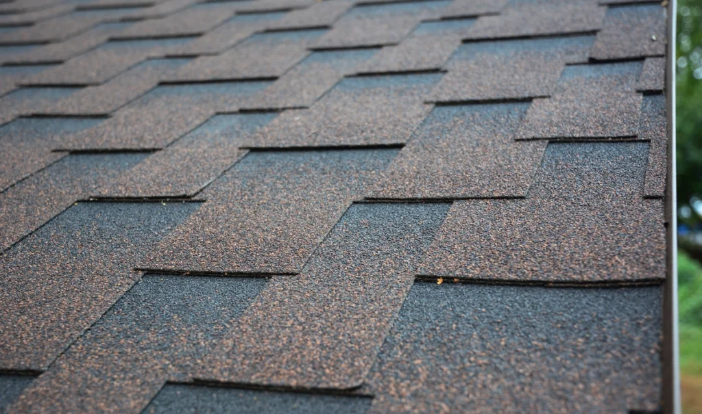 close up to roof with asphalt shingles