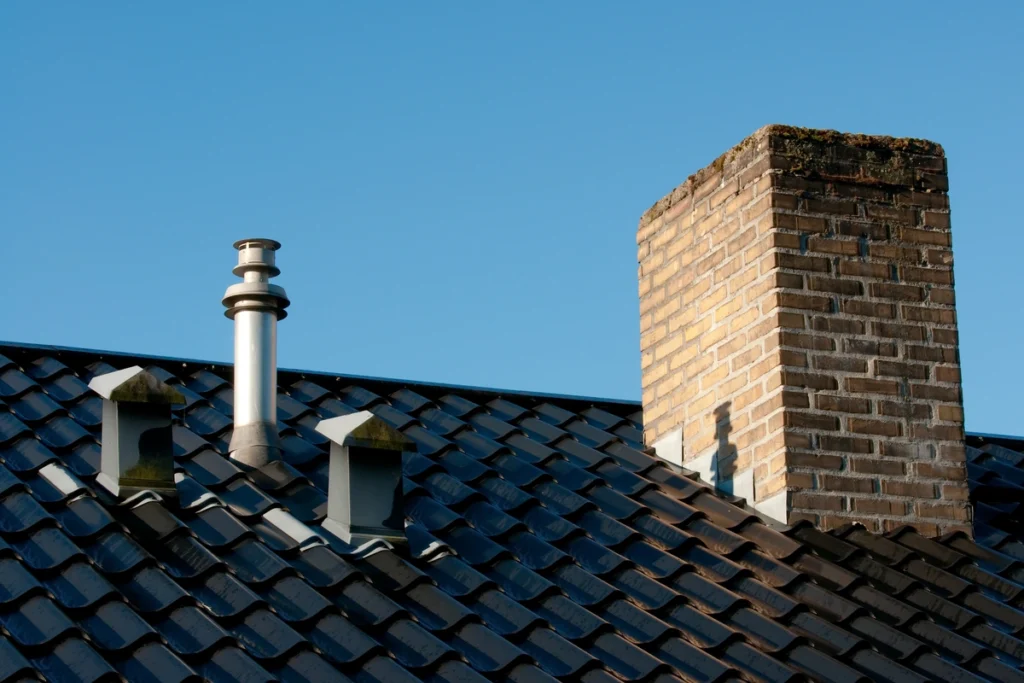 chimney flashing next to some roof vents