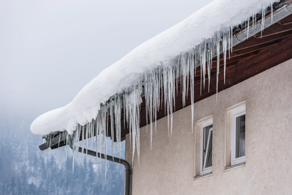 Icicles forming on the edge of the roof.